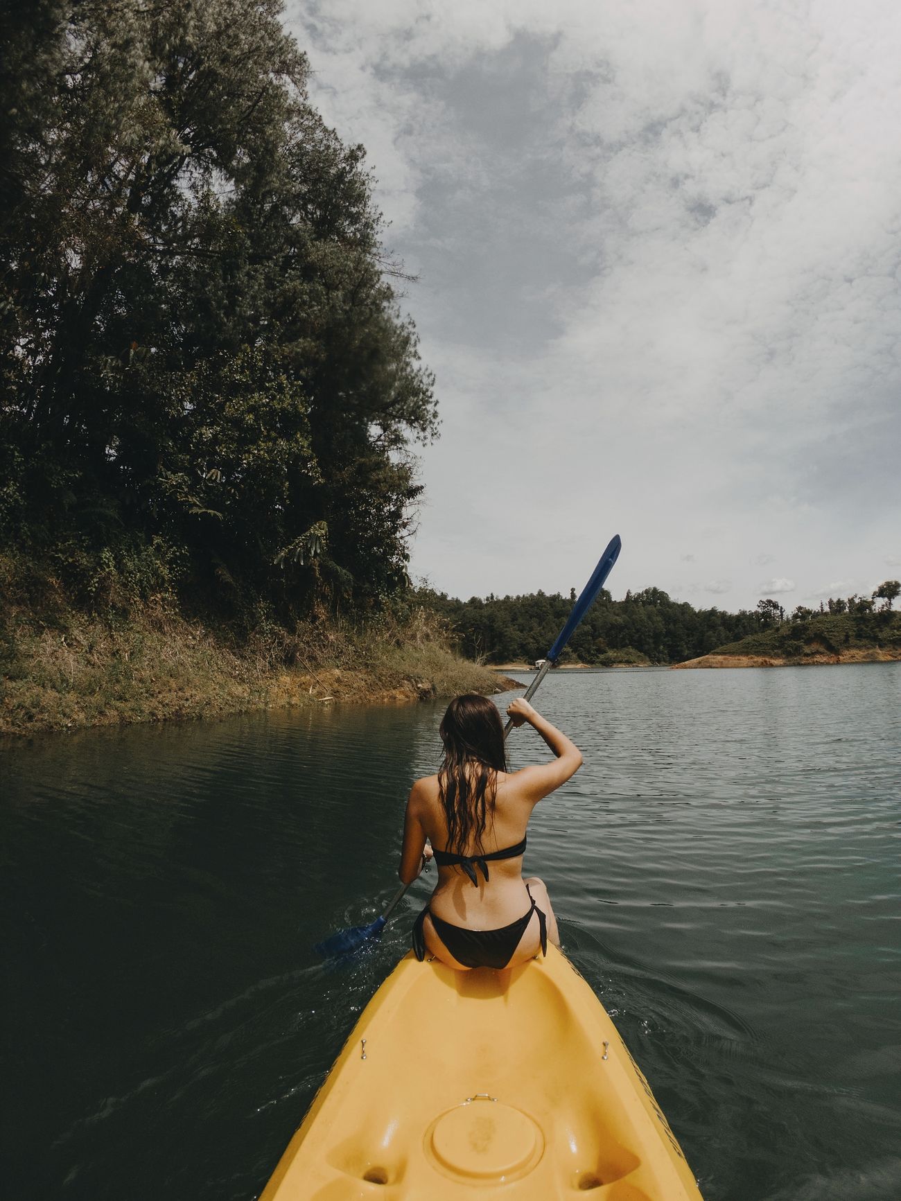 Person kayaking, adventure travel concept